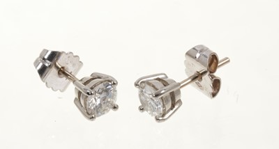 Lot 470 - Pair of diamond stud earrings, each with a round brilliant cut diamond in four claw setting with post fittings, estimated total diamond weight approximately 1.15cts