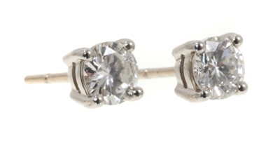 Lot 470 - Pair of diamond stud earrings, each with a round brilliant cut diamond in four claw setting with post fittings, estimated total diamond weight approximately 1.15cts