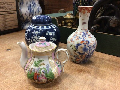 Lot 88 - Dresden porcelain teapot painted with figural scenes on a pink ground, with a Chinese blue and white prunus jar and a Japanese bottle vase (3)