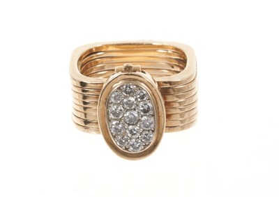 Lot 534 - Unusual diamond and gold combination ring and bracelet, the ring composed of eight square sections which unfold to form a bracelet, the pavé set diamond oval bezel forming the clasp.