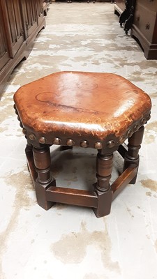 Lot 1069 - Oak hexagonal stool with studded leather top on turned and block legs joined by stretchers, together with an oak work box (2)