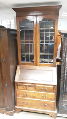 Lot 1072 - Edwardian walnut two height bureau bookcase with adjustable shelves above enclosed by two leaded glazed doors, writing compartment, two short and two long drawers below, 92cm wide, 47cm deep, 219cm...