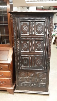 Lot 1073 - Antique heavily carved oak hall cupboard with two drawers below, 85cm wide, 47cm deep, 175cm high