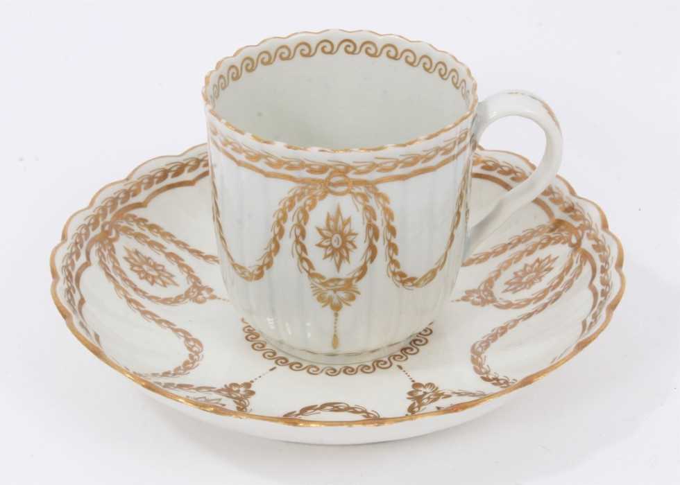 Lot 128 - A Worcester fluted gilt decorated coffee cup and saucer, circa 1775