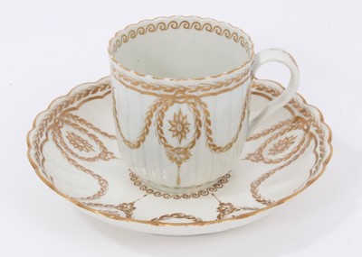 Lot 128 - A Worcester fluted gilt decorated coffee cup and saucer, circa 1775
