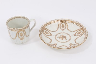 Lot 295 - A Worcester fluted gilt decorated coffee cup and saucer, circa 1775