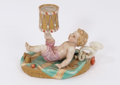 Lot 130 - A Royal Worcester chamber candlestick, modelled as a putto with a drum, mark for 1867
