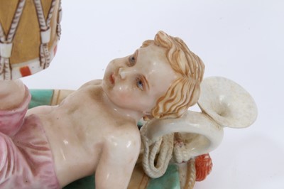 Lot 293 - A Royal Worcester chamber candlestick, modelled as a putto with a drum, mark for 1867