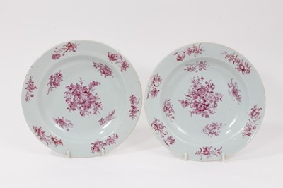 Lot 99 - A pair of 18th century Chinese Export plates, painted in puce with flowers