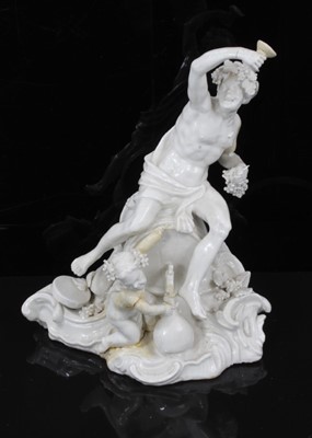 Lot 125 - An 18th century Italian porcelain group of Bacchus, in the white