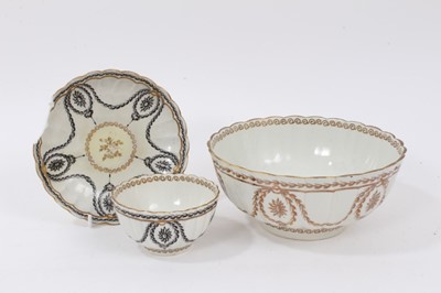 Lot 86 - A Worcester gilt decorated fluted round bowl, circa 1775, and a similar Worcester tea bowl and saucer