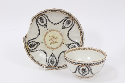 Lot 296 - A Worcester gilt decorated fluted round bowl, circa 1775, and a similar Worcester tea bowl and saucer