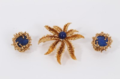 Lot 529 - 18ct gold flower shaped brooch set with a lapis lazuli sphere to the centre, together with a pair of lapis lazuli clip on earrings