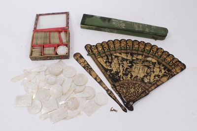 Lot 839 - Extensive collection of Chinese carved mother of pearl gaming counters, together with a Chinese lacquered fan