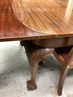 Lot 1080 - 1920's mahogany extending dining table with one extra leaf on carved cabriole legs with claw and ball feet, opening to 185cm x 107.5cm, together with a set of four matching dining chairs with pierc...
