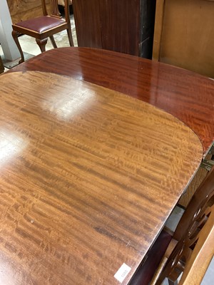Lot 1080 - 1920's mahogany extending dining table with one extra leaf on carved cabriole legs with claw and ball feet, opening to 185cm x 107.5cm, together with a set of four matching dining chairs with pierc...
