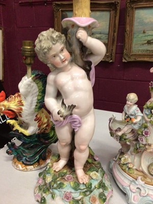 Lot 307 - 19th century Dresden Cupid table lamp, Continental figure lamp and a cockerel lamp (3)