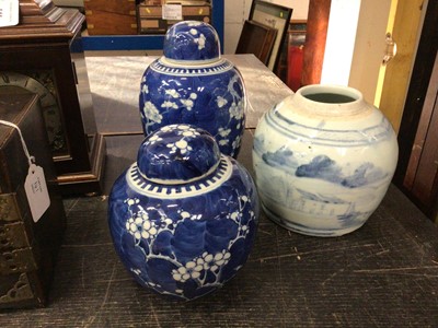 Lot 142 - Two Chinese blue and white prunus jars and covers, and another Chinese blue and white jar (2)