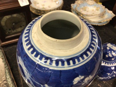 Lot 142 - Two Chinese blue and white prunus jars and covers, and another Chinese blue and white jar (2)