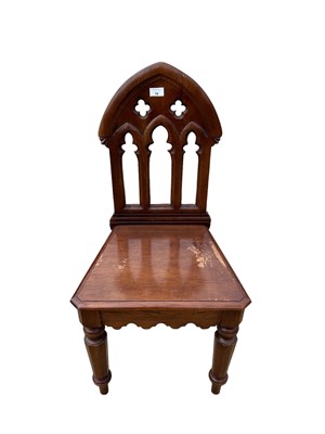 Lot 70 - Victorian Gothic hall chair with pierced decoration on faceted front legs