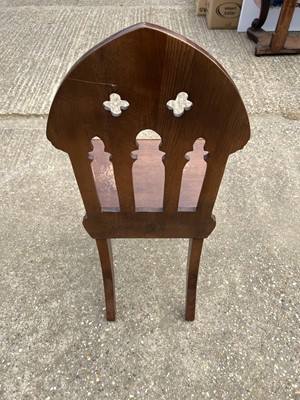 Lot 70 - Victorian Gothic hall chair with pierced decoration on faceted front legs