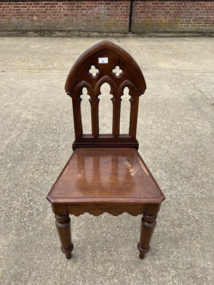 Lot 70 - Victorian Gothic hall chair with pierced decoration on faceted front legs