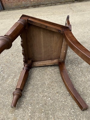 Lot 70 - Victorian Gothic hall chair with pierced decoration on faceted front legs