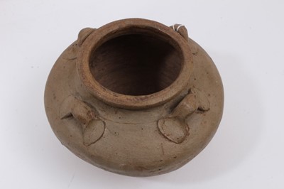 Lot 118 - Two early Chinese glazed pots with lugs around the shoulders