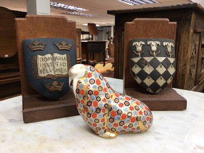Lot 163 - A pair of carved and painted armorial bookends, and a Royal Crown Derby walrus