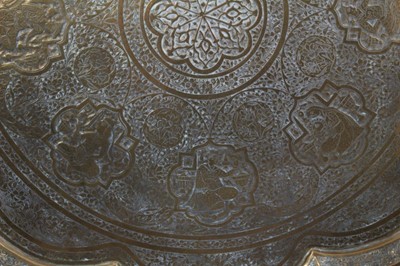 Lot 874 - Two Islamic engraved brass trays