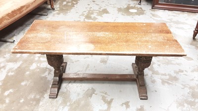 Lot 1130 - Oak refectory style coffee table on carved cup and cover end standards joined by stretcher, 107cm wide, 44cm deep, 46cm high