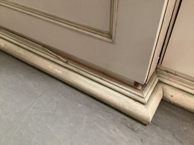 Lot 1132 - Georgian style white and green painted two height breakfront bookcase with adjustable shelves above, two central panelled doors below flanked by two caned doors, 252cm wide, 45.5cm deep, 223cm high