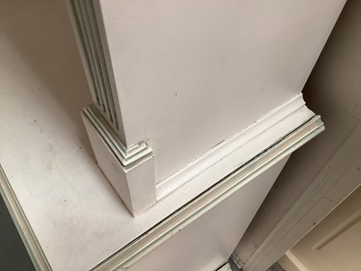 Lot 1132 - Georgian style white and green painted two height breakfront bookcase with adjustable shelves above, two central panelled doors below flanked by two caned doors, 252cm wide, 45.5cm deep, 223cm high