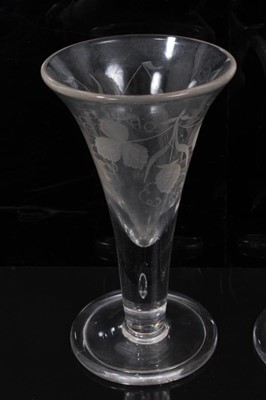 Lot 102 - A pair of Georgian ale glasses engraved with hops and barley, on folded foot