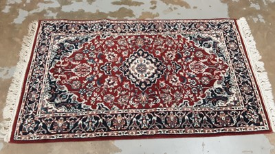 Lot 1136 - Eastern rug with floral decoration on red, blue and cream ground, 150cm x 89cm