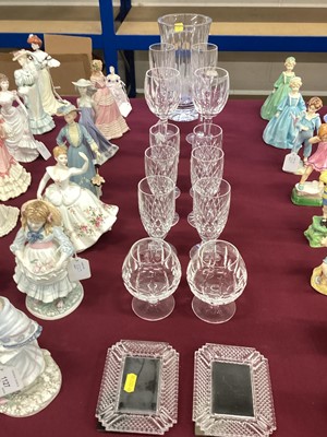 Lot 1128 - Waterford Crystal wine glasses, champagne flutes, brandy balloons and two small photograph frames, together with a Royal Doulton cut glass vase