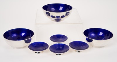Lot 263 - A set of three Danish modernist silver dishes with blue enameled interiors, and four others