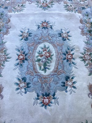 Lot 1141 - Chinese wash rug  with floral decoration on cream and blue ground, 274cm x 186cm