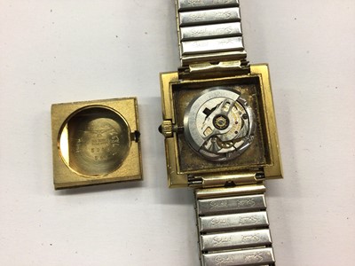 Lot 829 - 1970s Longines gold plated automatic wristwatch with black square dial and Roman numeral markers