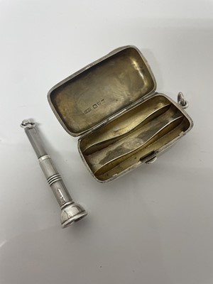 Lot 845 - Late Victorian silver cheroot case of rounded rectangular form, (Chester 1900), together with a silver cigar pricker with engine turned decoration (2)