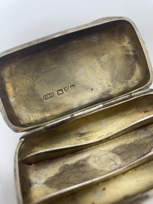 Lot 845 - Late Victorian silver cheroot case of rounded rectangular form, (Chester 1900), together with a silver cigar pricker with engine turned decoration (2)