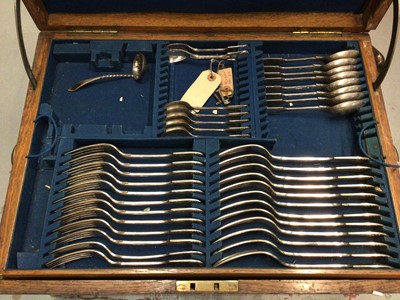 Lot 301 - Part set of silver plated  Fiddle, shell and thread cutlery in an oak canteen.