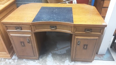 Lot 1154 - Early 20th century oak kneehole desk with three drawers and two cupboards below, 128cm wide, 81.5cm deep, 78.5cm high