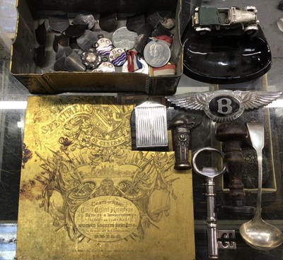 Lot 860 - Group of silver and white metal fobs and plaques, medals, Bentley car badge, two seals, bottle opener in the form of an antique key and sundries