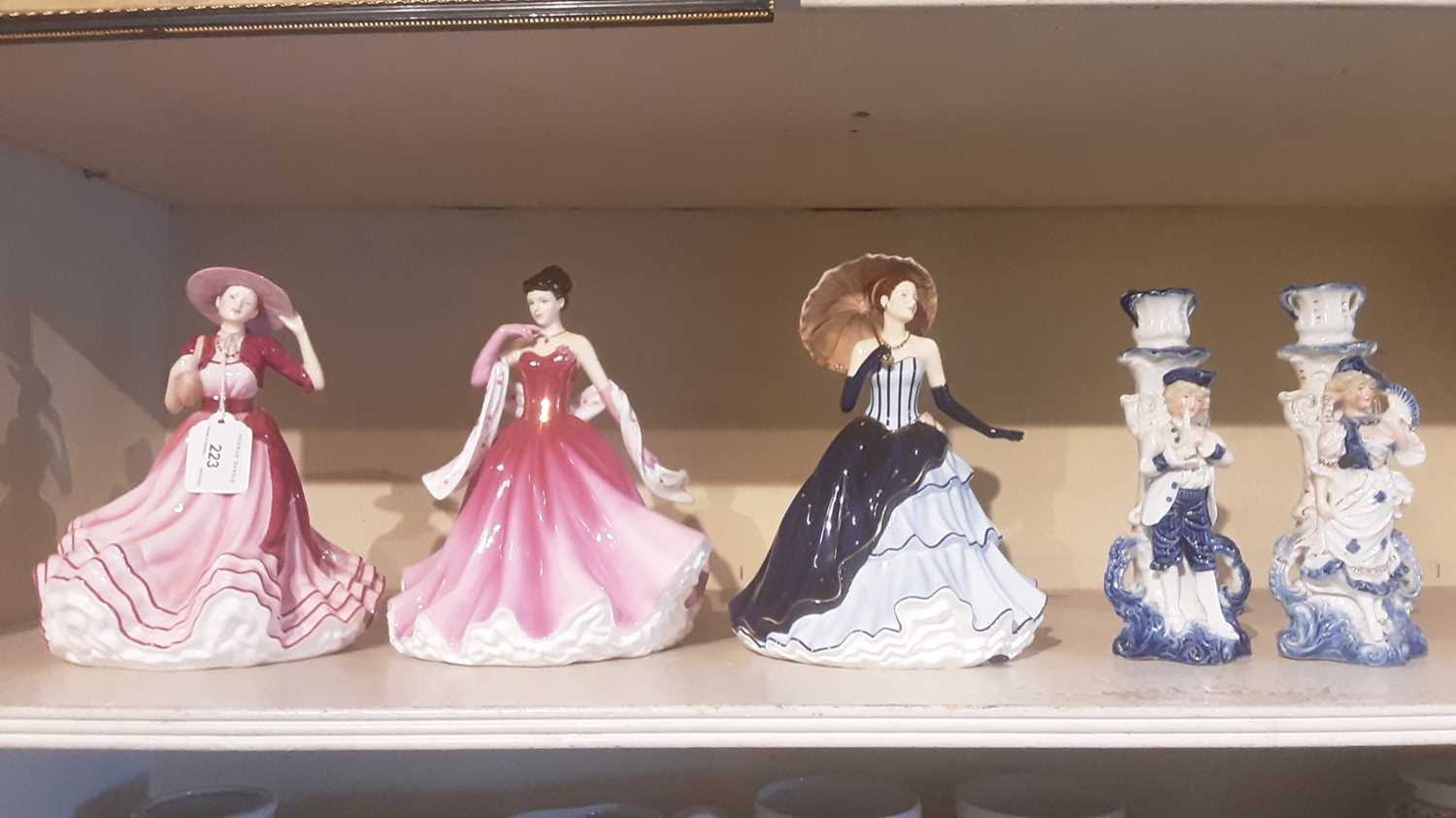 Lot 223 - Three Royal Doulton Pretty Ladies - Kate HN5527, Alexandra HN5373 and Amy HN5515, together with a pair of old blue and white porcelain spill vases (5)