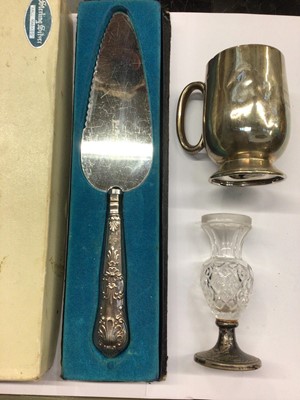 Lot 863 - 1920s silver Christening mug, silver mounted cut glass posie vase and a silver handled cake slice in box