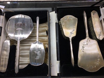 Lot 872 - Two cased silver backed dressing table brush and mirror sets