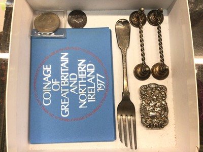 Lot 893 - White metal vesta case with cherub and scroll decoration, Georgian silver fork, pair of plated knife rests and coins