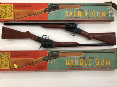 Lot 1932 - Group of vintage toys to include two Lone Star Saddle guns, one box of mixed games, one box of model kits, one box of assembled models and one box of model trains and tanks.