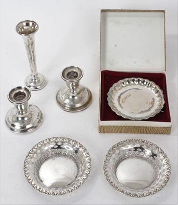 Lot 334 - Pair of silver pin dishes, another pin dish in box, a spill vase and pair of silver candlesticks